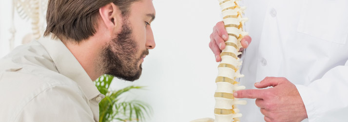 Chiropractic Canton MA Back Pain Man With Doctor Chiropractic Canton MA Back Pain Man With Doctor