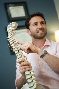 Chiropractor Canton MA Joel Favreau With Spine Model